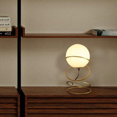 Spiral 4-ring metal stand detail on matte gold table lamp