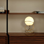 Spiral 4-ring metal stand detail on matte gold table lamp