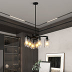 Matte black 6-light chandelier hanging over dining room table