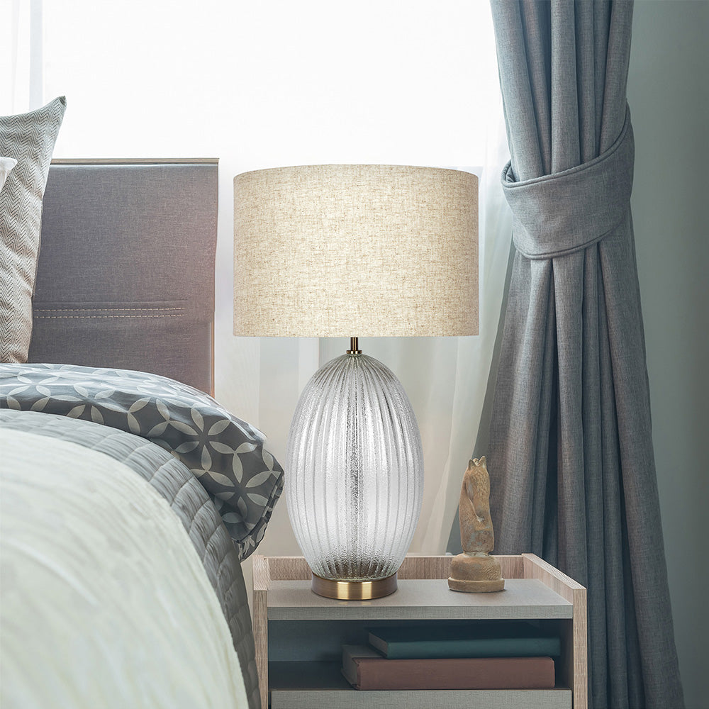 Aurora glass lamp with large linen shade in living room