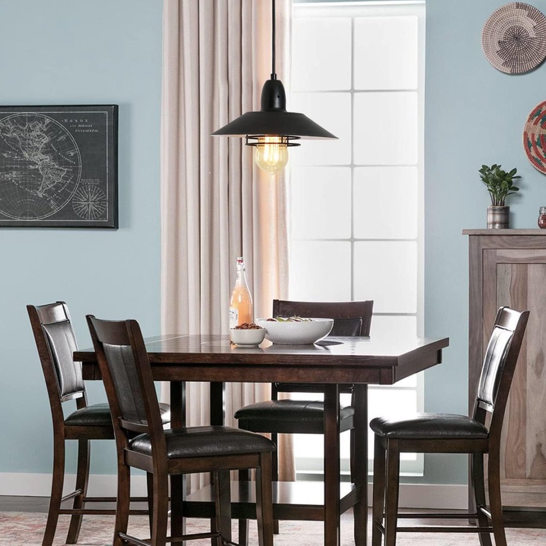 Vintage cage pendant light in dining room farmhouse setting