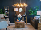 Drum shade desk lamp glowing softly on bedroom nightstand