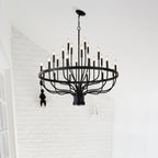 black iron 24 candle chandelier installed in dining room
