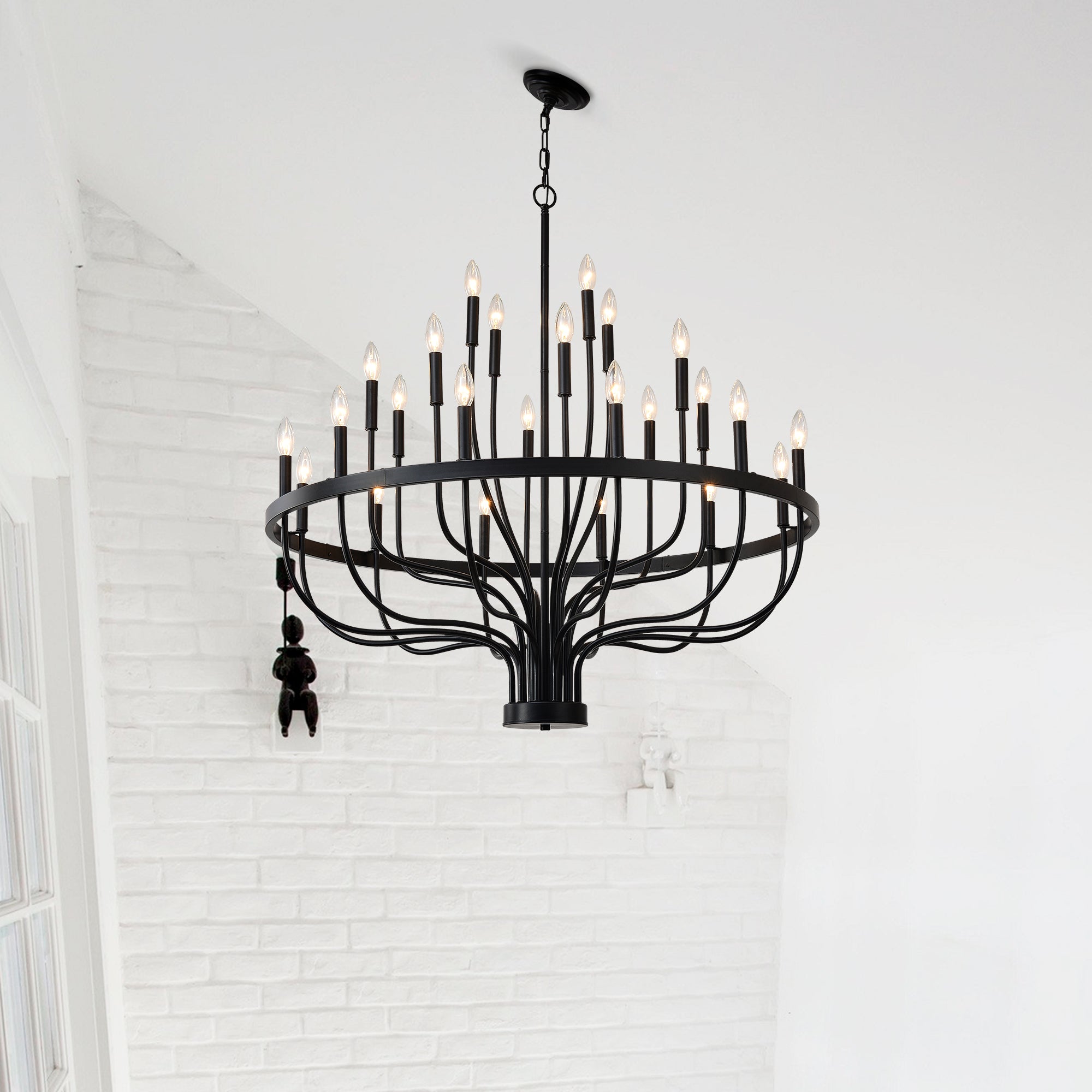 black iron 24 candle chandelier installed in dining room