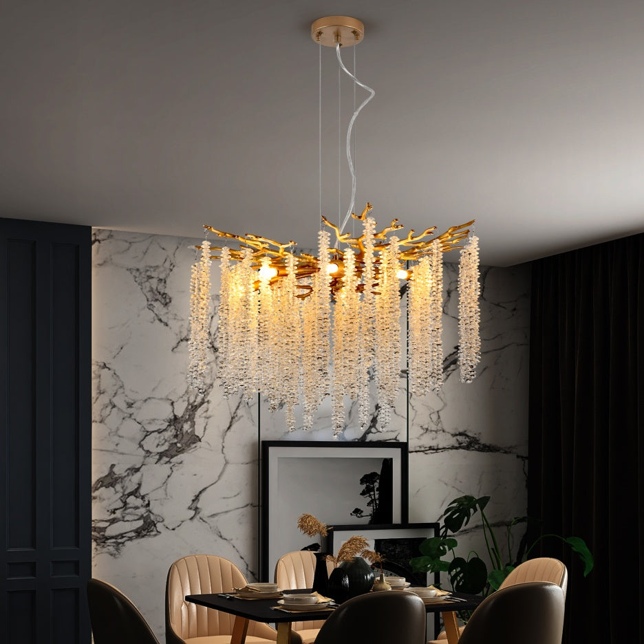 Gold crystal strand chandelier hanging in luxury dining room