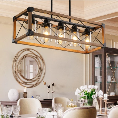 5-light walnut chandelier illuminating modern farmhouse dining room