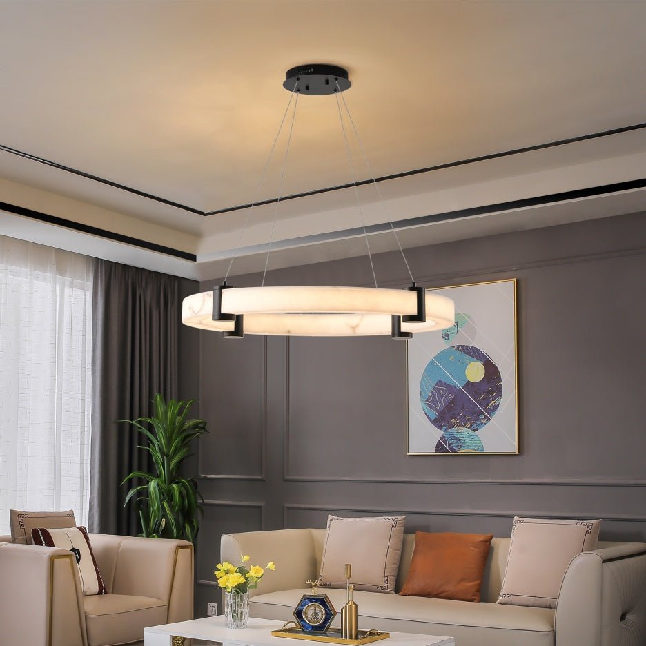 Marble LED pendant light hanging over dining table